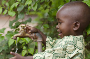 african boy drinking water